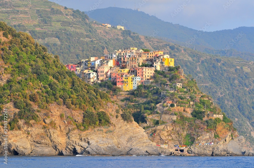 Italy, Liguria, Cinque Terre, Corniglia, Multi colored town architecture among hills.