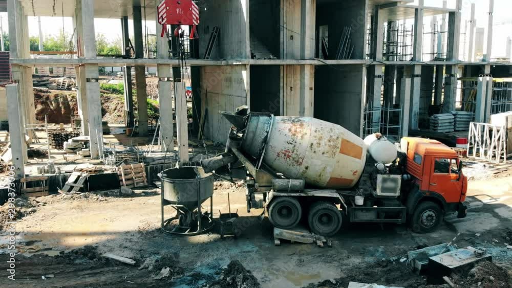 Cement-mixing machine at the building site Cement-mixing machine at the building site