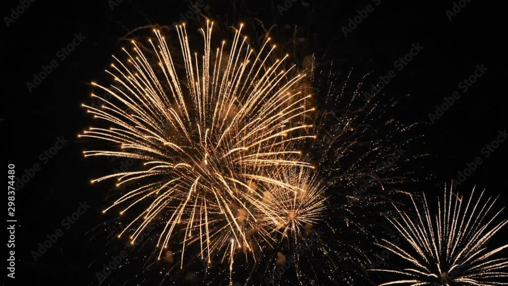 Aerial view bright festive fireworks on a dark sky background late at night. Beautiful flashes of fireworks in the sky. Multicolored flashes. Glitter. City Day holiday on New Year's Eve. Lifestyle Aerial view bright festive fireworks on a dark sky background late at night. Beautiful flashes of fireworks in the sky. Multicolored flashes. Glitter. City Day holiday on New Year's Eve. Lifestyle