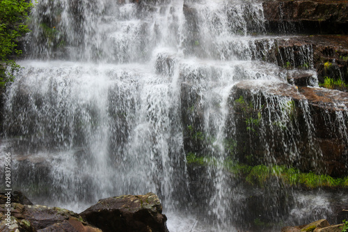 Wallpaper Mural Beautiful close up of amazing waterfall Tupavica on Old mountain, near Dojkinci, with vivid green moss, splashing water and red rocks Torontodigital.ca