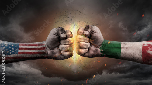 USA vs Italy. Fists with flags. Battle of two countries on sky. © JustLife