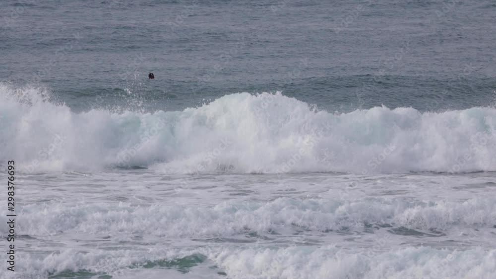 Male surfer falling into a collapsing wave. The surfboard pops out of the water later in the clip. Slow motion shot. Male surfer falling into a collapsing wave. The surfboard pops out of the water later in the clip. Slow motion shot.