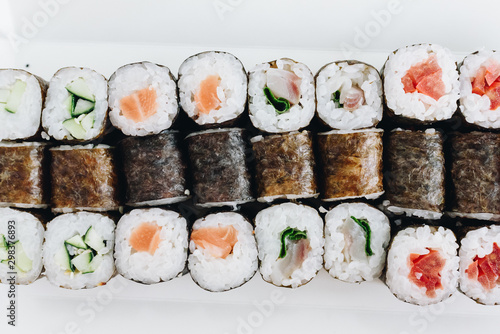 Top view of sushi maki rolls isolated on white