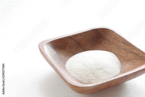 White agar powder on wooden plate for cooking image