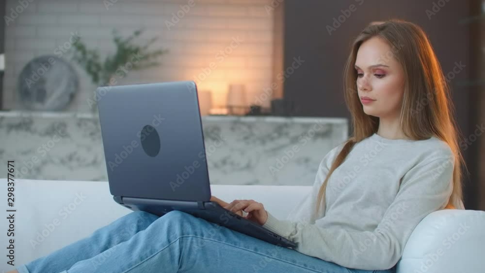Young woman having break at work on laptop computer at home. Business woman stop using laptop at kitchen. Happy person finish work notebook at home. Female freelancer have break at online work. Young woman having break at work on laptop computer at home. Business woman stop using laptop at kitchen. Happy person finish work notebook at home. Female freelancer have break at online work.