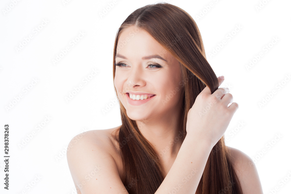 Hair care. portrait of a beautiful girl with long silky hair. Attractive young woman touches the hair