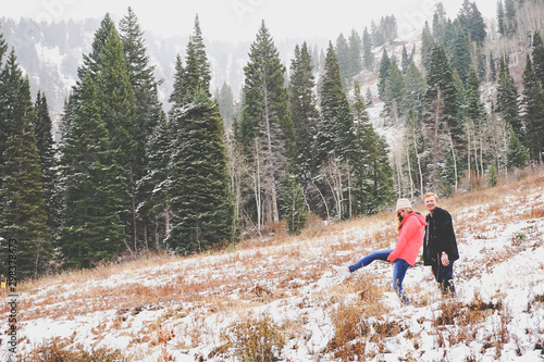 Cute young couple in the mountains exploring