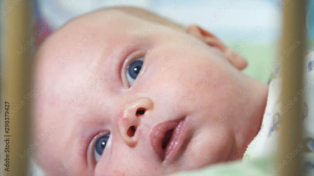 Extreme close portrait of cute newborn baby boy with blue eyes Extreme close portrait of cute newborn baby boy with blue eyes