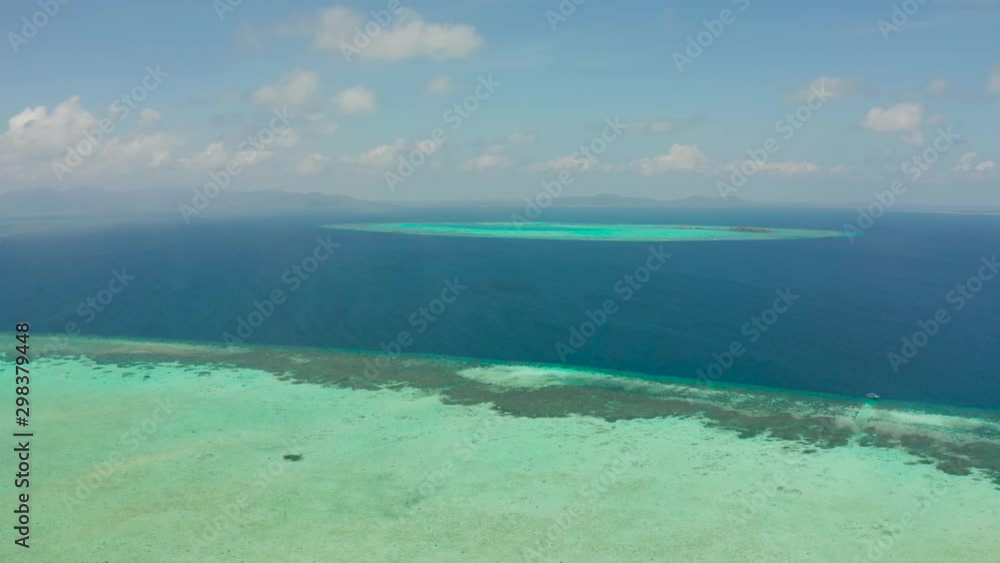 Tropical islands and coral atolls with blue water of the sea, aerial view. Balabac, Palawan, Philippines. Summer and travel vacation concept. Tropical islands and coral atolls with blue water of the sea, aerial view. Balabac, Palawan, Philippines. Summer and travel vacation concept.