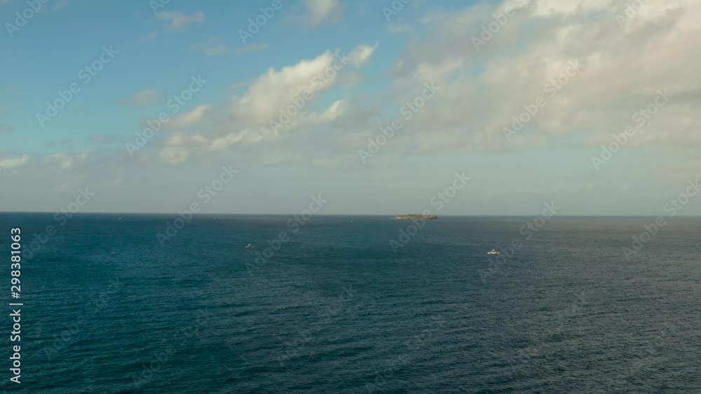 Cloud scape: Blue sky with clouds over the sea and island Pescador, aerial view. Seascape: Ocean and sky, Cebu, Philippines. Cloud scape: Blue sky with clouds over the sea and island Pescador, aerial view. Seascape: Ocean and sky, Cebu, Philippines.
