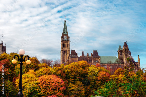 Wide Shot of Fall Foliage in Front of Canadian Parliament Building photo