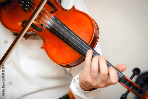 Violin playing viola musician playing . Man violinist classical musical instrument  fiddle .