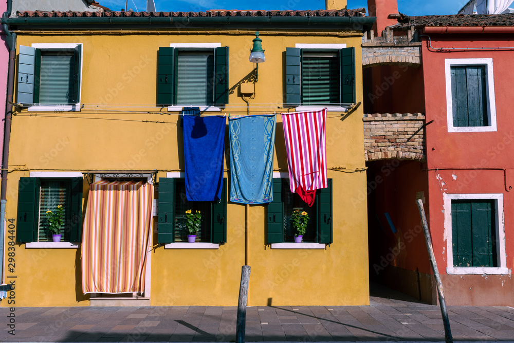 colorful clothes hanging on the wall in Burano Italy