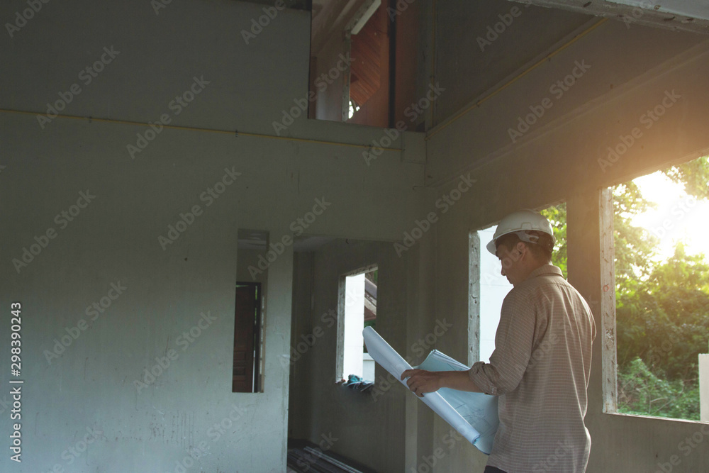 Architect and Engineer planing with blueprint and discuss at Construction Site Architect and Engineer planing with blueprint and discuss at Construction Site