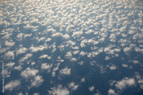 Stratocumulus clouds on a blue sky during a bright sunny day