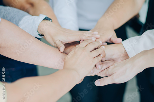 Group of business people putting their hands together teamwork join hands , Unity and teamwork concept © Sakan