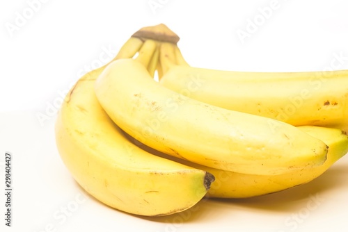 Yellow fresh banana isolated against white, selective focusing