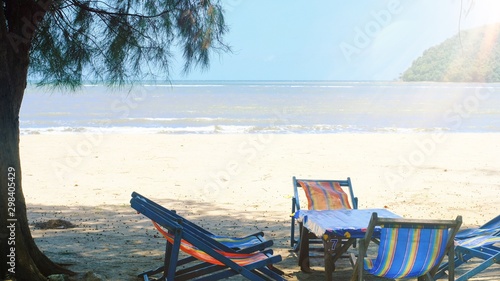 Fototapeta Naklejka Na Ścianę i Meble -  Colorful beach chairs on the beach with sunlight in the morning summertime at tropical island Thailand.