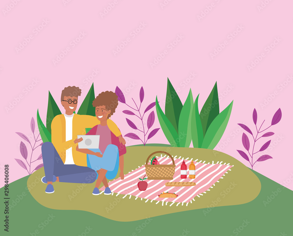 Fototapeta premium couple with tablet with food blanket picnic outdoor