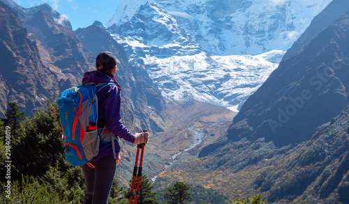 Canvas Print Active hiker hiking, enjoying the view, looking at Himalaya mountains landscape