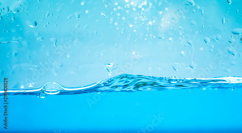 blue water waves with with bubbles on a white background