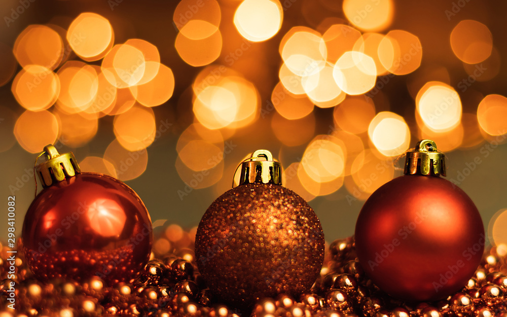 Christmas ornaments lying on balls of a Christmas chain on a blurred background with lights. Christmas ornaments lying on balls of a Christmas chain on a blurred background with lights.