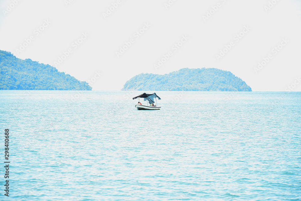 Small wooden fishing boat is floating in sea. Business of fishing boat concept. Small wooden fishing boat is floating in sea. Business of fishing boat concept.