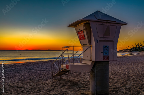 Sunset in Laguna Beach  famous tourist destination in California  USA with a lifeguard station in the foreground