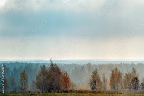 Autumn morning rural landscape in backlit with fog