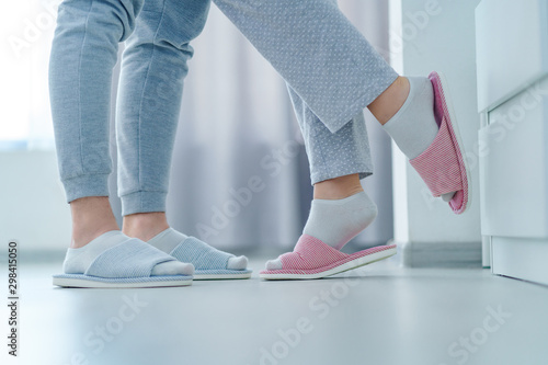 Loving married couple together in home soft comfortable slippers, family concept