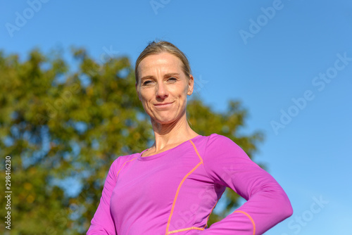 Confident fit blond woman with a friendly smile