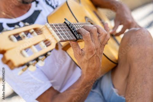 Flamenco musician playing Spanish guitar in Granada..