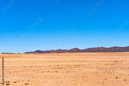 Beautiful view of desert with clear blue sky from road trip in NAMIBIA