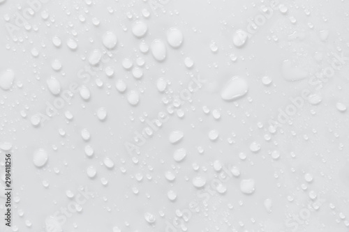 Raindrops on a grayish white background. Rainy season concept. © prasong.
