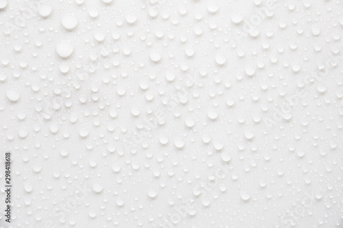 Raindrops on a grayish white background. Rainy season concept.