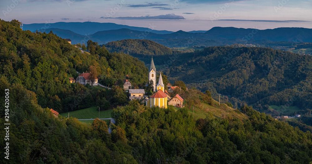 Panoramic landscape with two churches in small village Zusem in Stajerska (Styria), Slovenia