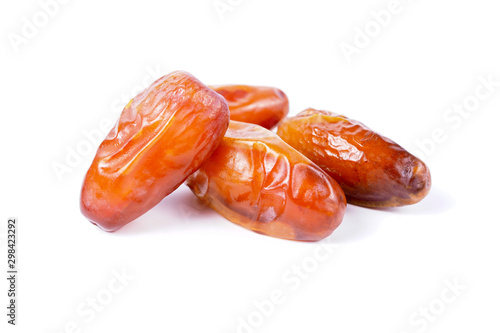 Close up fruits of date palm on white background