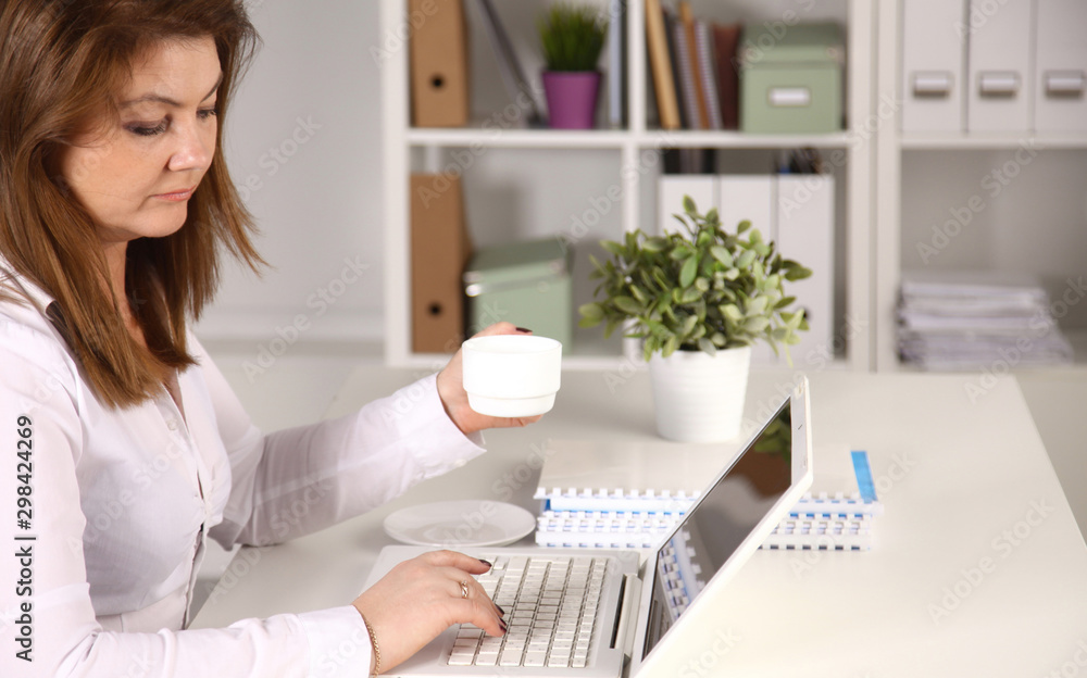 Young businesswoman working on a laptop Young businesswoman working on a laptop
