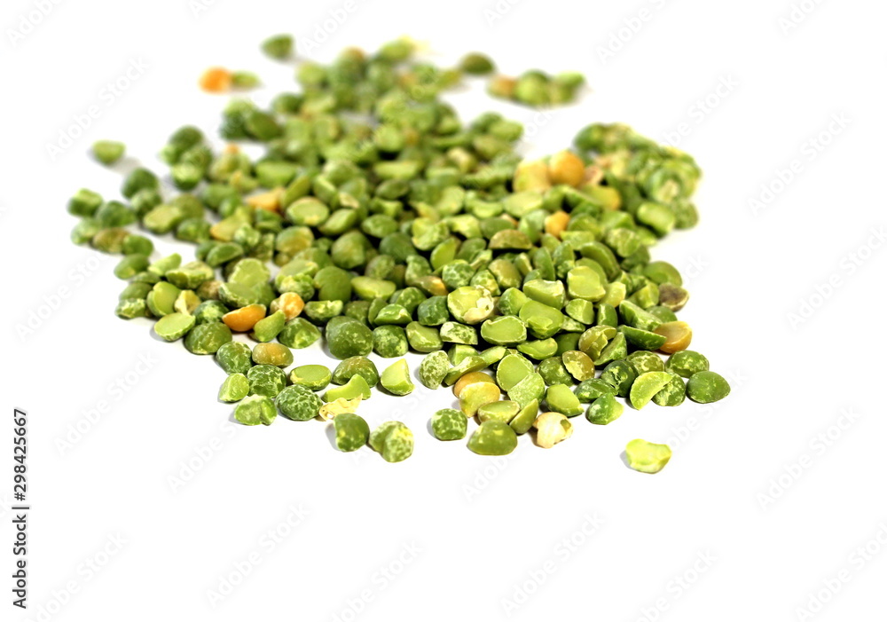 Dry green peas on a white background. Pea texture. Chipped dry peas for soup. Dry green peas on a white background. Pea texture. Chipped dry peas for soup.