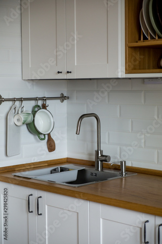 the tap is light kitchen with white wall