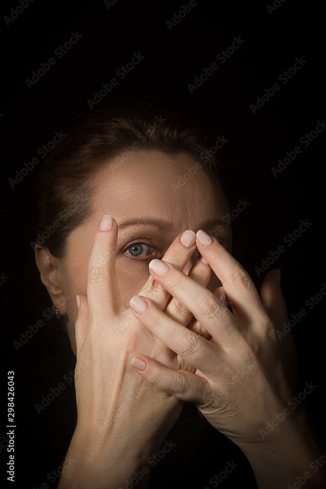 Woman covers her face with hands. Woman covers her face with hands.