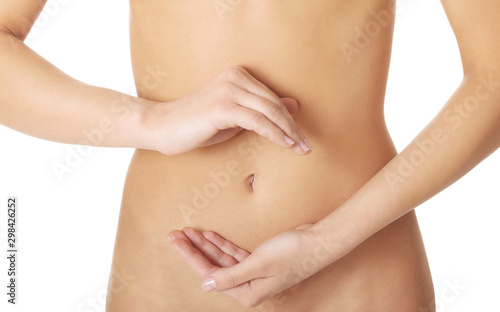 Woman making circle shape with hands on fit belly. Digestion and colon concept.