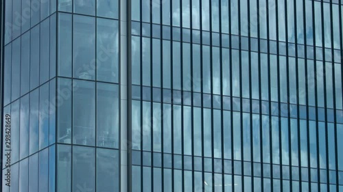 Wallpaper Mural Background with skyscraper. Clouds and blue sky reflected on shiny glass. Torontodigital.ca