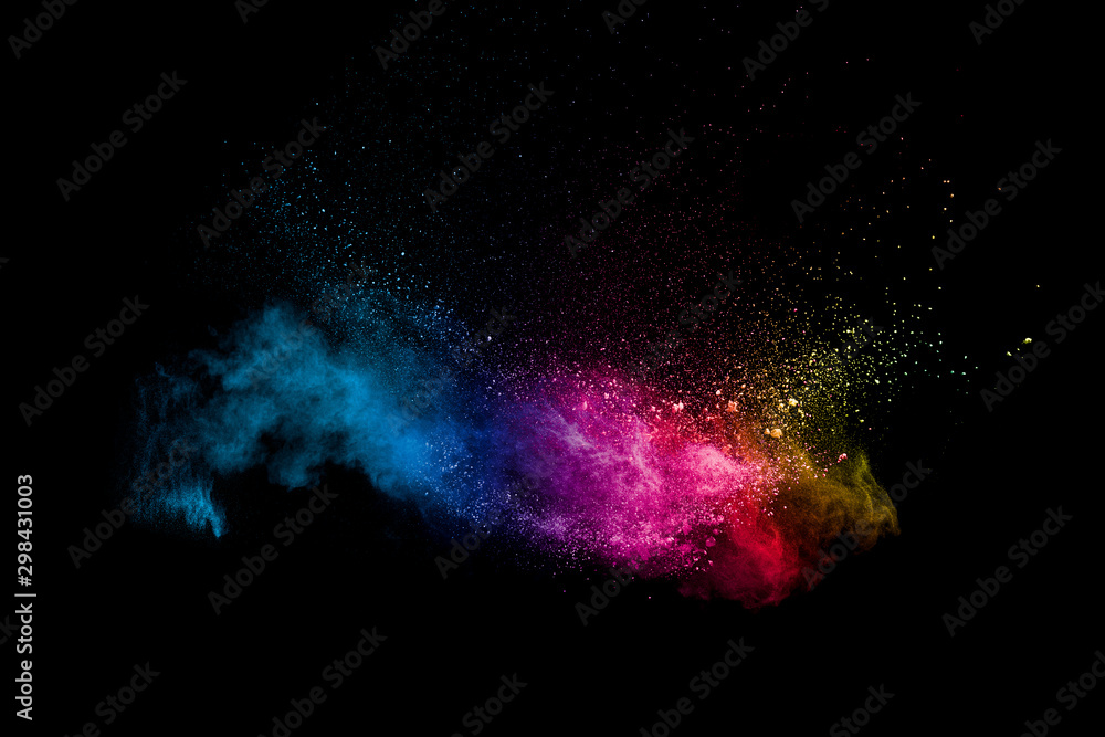 Fototapeta Colorful powder explosion on black background. Abstract pastel color dust particles splash.