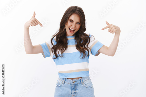 Proud ambitous good-looking cheeky brunette woman boastful telling own accomplishment, brag personal achievement pointing herself act like professional, being winner, stand white background