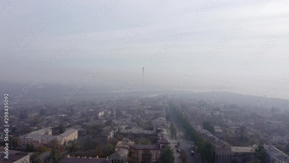 Cloud of fog and smog pollution covers the city. aerial view. Cloud of fog and smog pollution covers the city. aerial view.