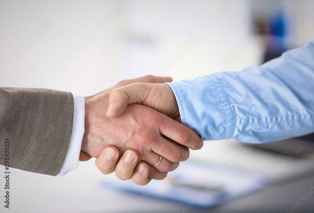 Business handshake. Two businessman shaking hands with each oth Business handshake. Two businessman shaking hands with each oth