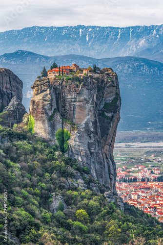 Bild auf Leinwand Meteora with monastery of Holy Trinity and Kalambaka town
