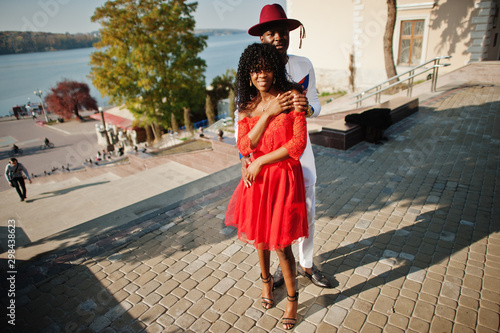 Stylish trendy afro france couple posed together at autumn day. Black african models in love.