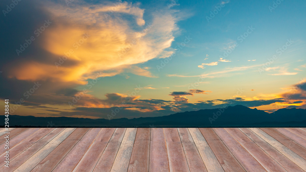 Wooden table top on sunset sky background - can be used for display or montague your products.Mock up for display of product. Wooden table top on sunset sky background - can be used for display or montague your products.Mock up for display of product.